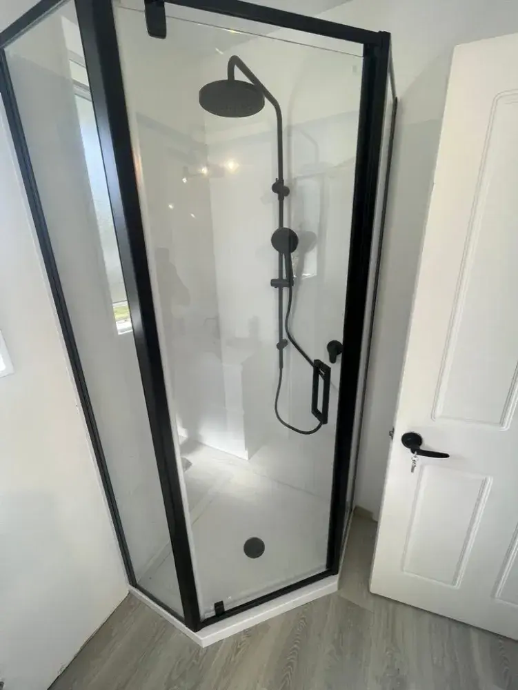 Modern black-framed glass shower